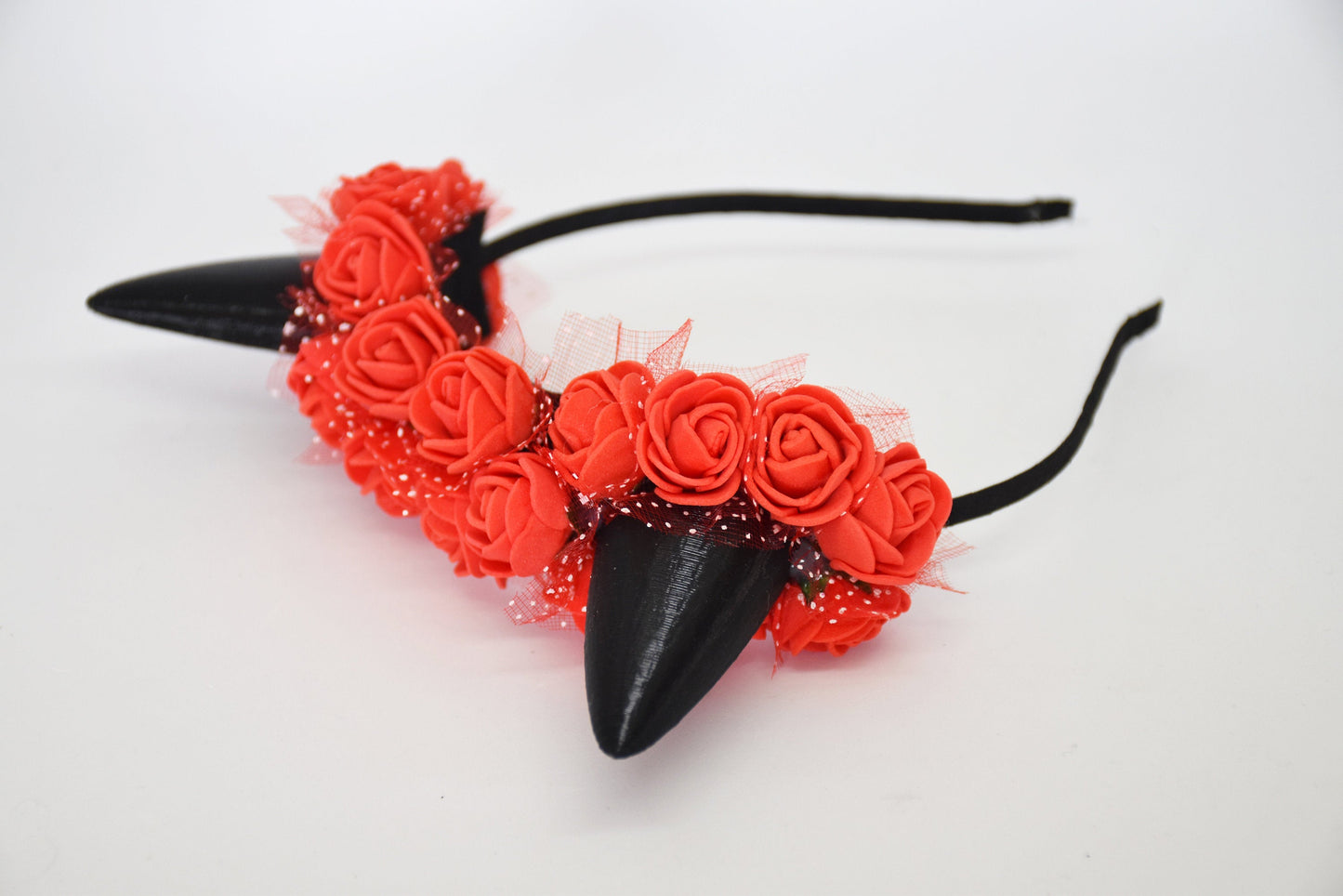 Cute cat ears with red flowers