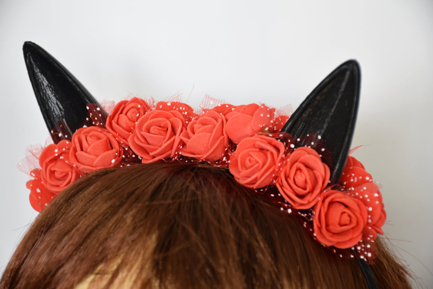 Cute cat ears with red flowers