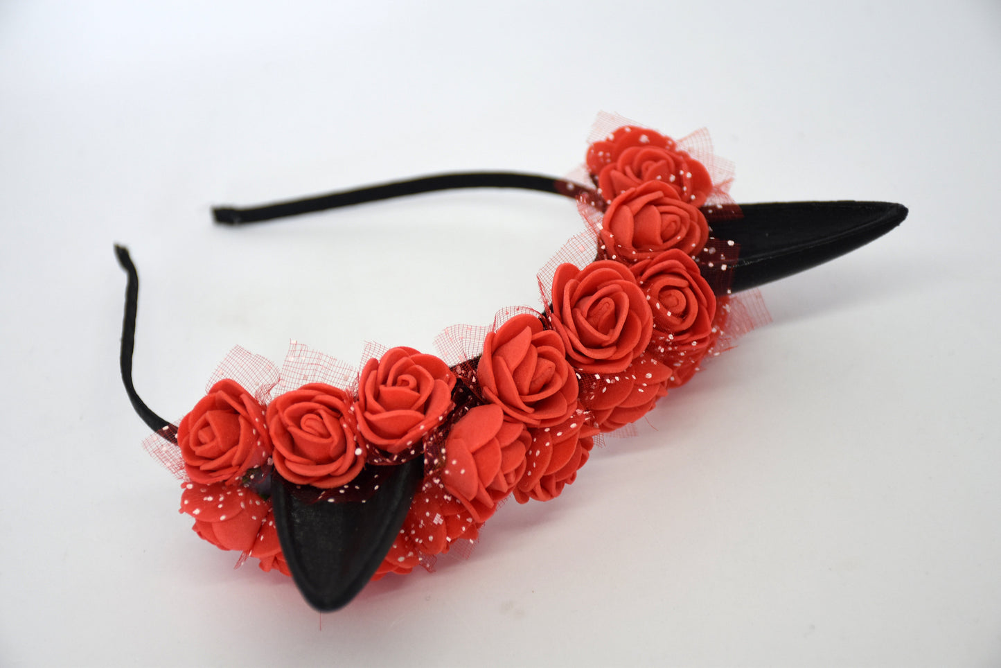 Cute cat ears with red flowers