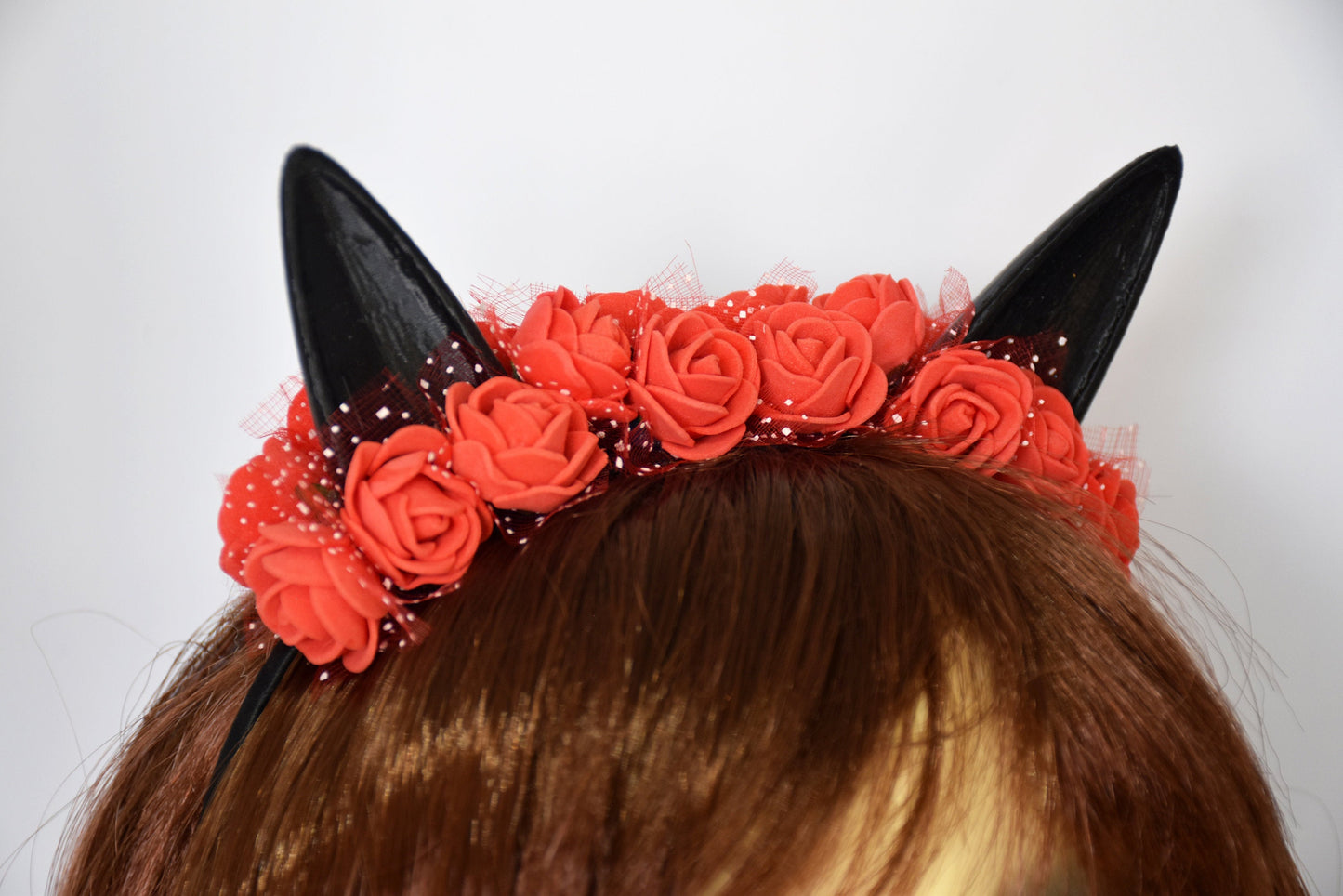 Cute cat ears with red flowers