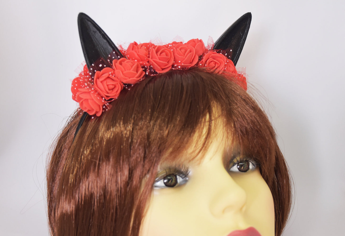 Cute cat ears with red flowers