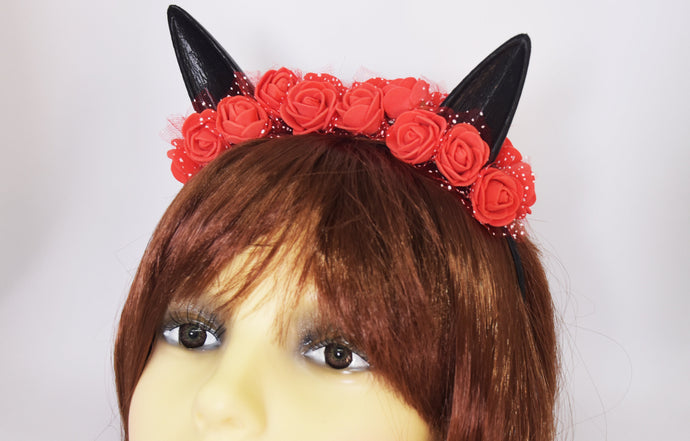 Cute cat ears with red flowers